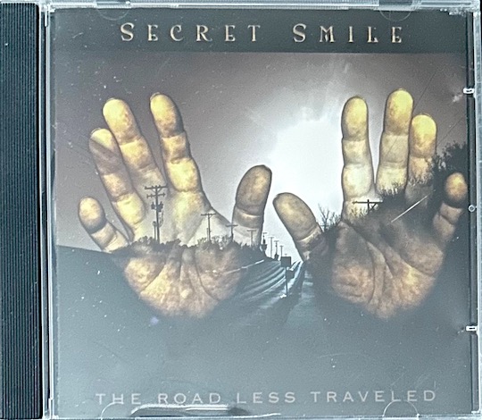 Secret Smile – The Road Less Travelled